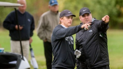 Jack and Coach Hogan discuss on the course